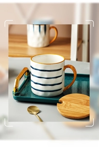 Japanese ceramic mug set with blue stripes, gold handle, bamboo lid and green tray