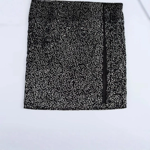 Women's chic black sequin mini skirt featuring a flat-lay design with high-density sequins