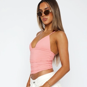 Side view of pink V-neck cropped camisole featuring stylish ruched fabric details