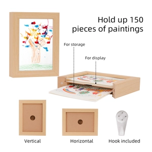 Macro detail of wooden kids art frame with storage for 150 drawings and elastic straps