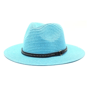 Detail of teal straw fedora hat featuring a black studded band with a golden buckle
