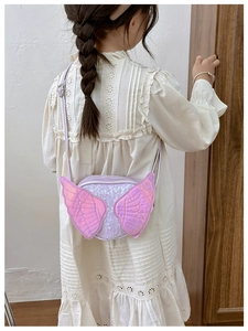 Rear view of a girl wearing a purple sequined angel wing crossbody bag with laser finish