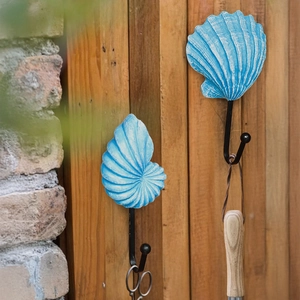 Set of two vintage ocean style resin wall hooks with scallop and nautilus shell designs
