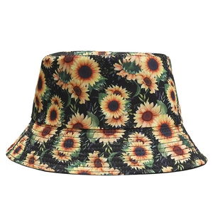 Women's outdoor sunflower print bucket hat in black with yellow floral pattern