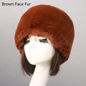 Close-up of thick brown faux fox fur hat showing plush texture and warmth on model