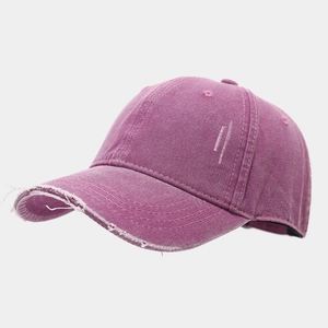 Detail view of washed purple cotton baseball cap with distressed brim and side embroidery