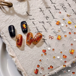 Minimalist cartoon nail art stickers with silver stamping and cute orange cat designs