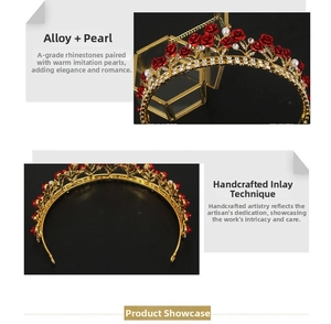 Detailed view of alloy bridal crown with red roses, white pearls and sparkling rhinestones