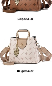 Detailed view of women's crossbody bags with logo patterns and gold leaf charms