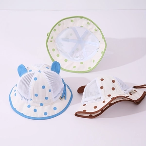 Detail of baby summer hats featuring breathable mesh crowns and cute 3D ears on polka dot fabric