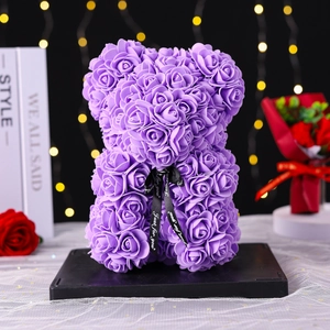 Detailed view of 25cm purple PE foam rose bear with Just for you ribbon and bokeh lights