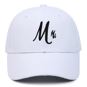 Close-up of high-quality black Mr. letter embroidery on a white cotton baseball cap