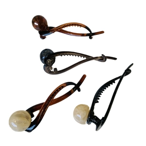 Elegant four-piece twist hair clip set with round beads in black and brown finish