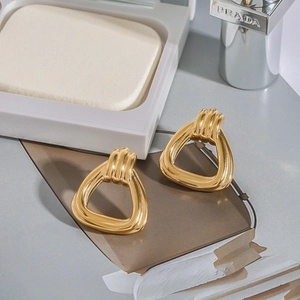18k gold plated stainless steel geometric triangle earrings with spiral texture design