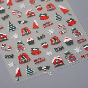 Detailed 3D embossed Christmas nail stickers featuring festive trees and red candy motifs