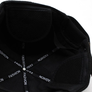 Detail view of winter baseball cap interior with reinforced 'FASHION' webbing and cotton lining