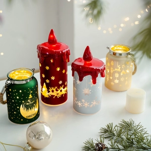 Festive Christmas LED lantern set with warm glow on a wooden table with pine decor