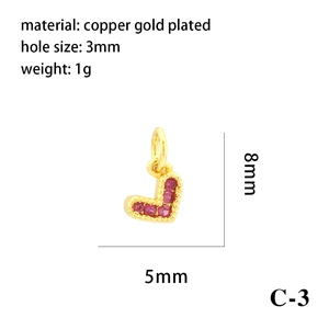 Macro shot of 18K gold plated heart charm with red zircon, 8x5mm size and 3mm hole