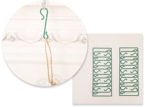 Detail of green metal S-shaped hooks for hanging Christmas decorations and ornaments