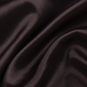 Close-up of deep brown silk fabric showing smooth satin texture and diagonal twill weave