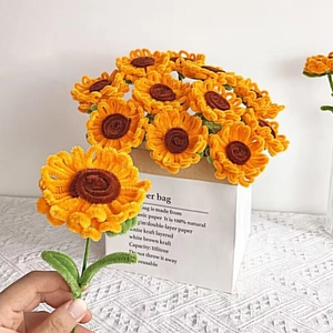 Detail of a handmade pipe cleaner sunflower bouquet with yellow petals and green stem