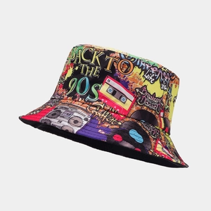 Detail of colorful retro 90s graffiti print on a black bucket hat with radio patterns