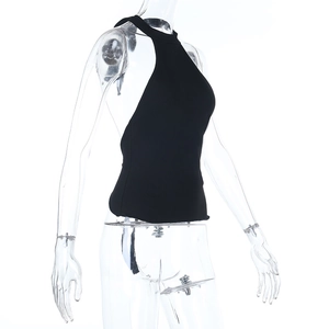 Detail view of the side profile on a black halter neck knitted slim-fit vest