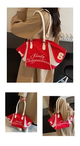 Detail view of red bowling bag with mesh patchwork and white leather handles