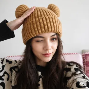 Warm brown knitted beanie with cute bear ears and ribbed texture for winter fashion