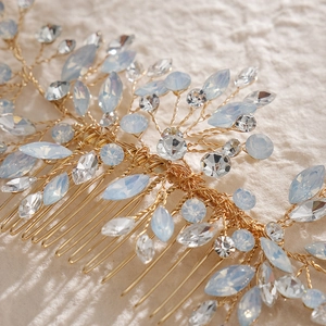 Exquisite gold bridal hair comb with light blue rhinestones for wedding hairstyles
