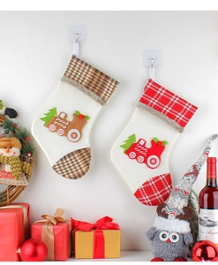 Festive Christmas stockings with train applique embroidery hanging as holiday wall decor