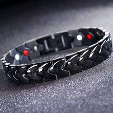 Macro shot of black titanium steel magnetic bracelet with red and white functional dots
