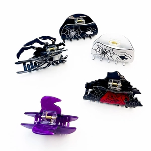 Halloween claw clips set featuring black spider and purple ghost designs for hair styling
