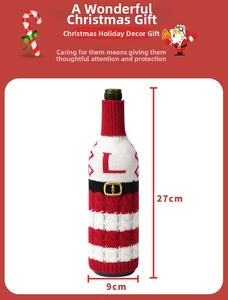 Detail of red and white striped Christmas wine bottle cover with knit letter L
