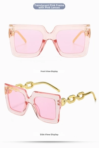 Macro detail of oversized transparent pink sunglasses with golden metal chain temples