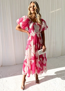 Detail of elegant off-shoulder floral dress with smocked bodice and puff sleeves