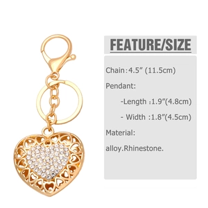 Detail view of gold heart keychain with white rhinestones and size specifications