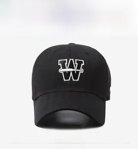 Front close-up of a black baseball cap featuring 3D white embroidered letter W and bat