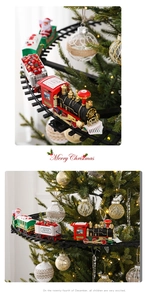 Close-up of a Christmas tree train set circling branches with warm holiday lighting