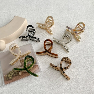Set of eight stylish acetate hair claws in various patterns like leopard and zebra print