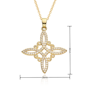 Detail of a 30mm gold-plated Celtic knot pendant with sparkling white zircons on a white base