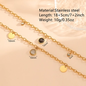 Gold stainless steel bracelet with grey cat eye stone and cubic zirconia charms