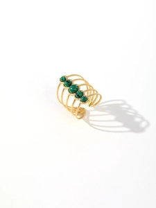Detailed close-up of a 18k gold plated multi-layer ring with five green malachite stones