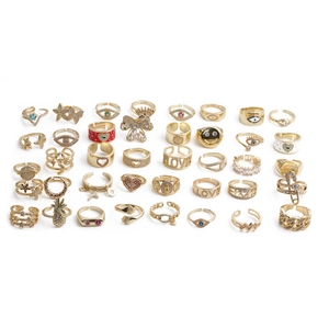 Collection of gold-plated copper rings featuring star, heart, and butterfly motifs