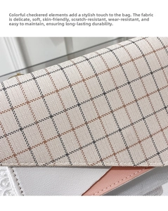 Detail of color-block plaid fabric and smooth leather texture on a small crossbody bag