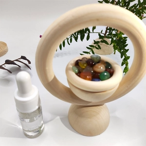 Vertical wooden essential oil diffuser set with colorful agate stones and dropper bottle