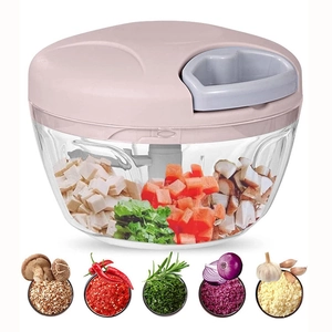 Pink manual food processor with stainless steel blades for chopping vegetables and garlic