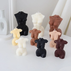 Artistic female torso candles in various neutral tones and sizes for modern home decor