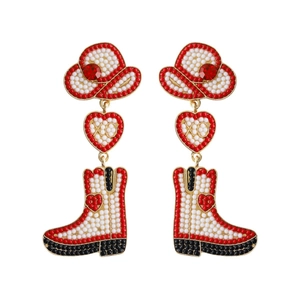 Detail of beaded cowboy boot earrings with hat and heart motif on white background