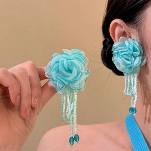 Elegant silver needle earrings with blue fabric flowers and long beaded crystal tassels